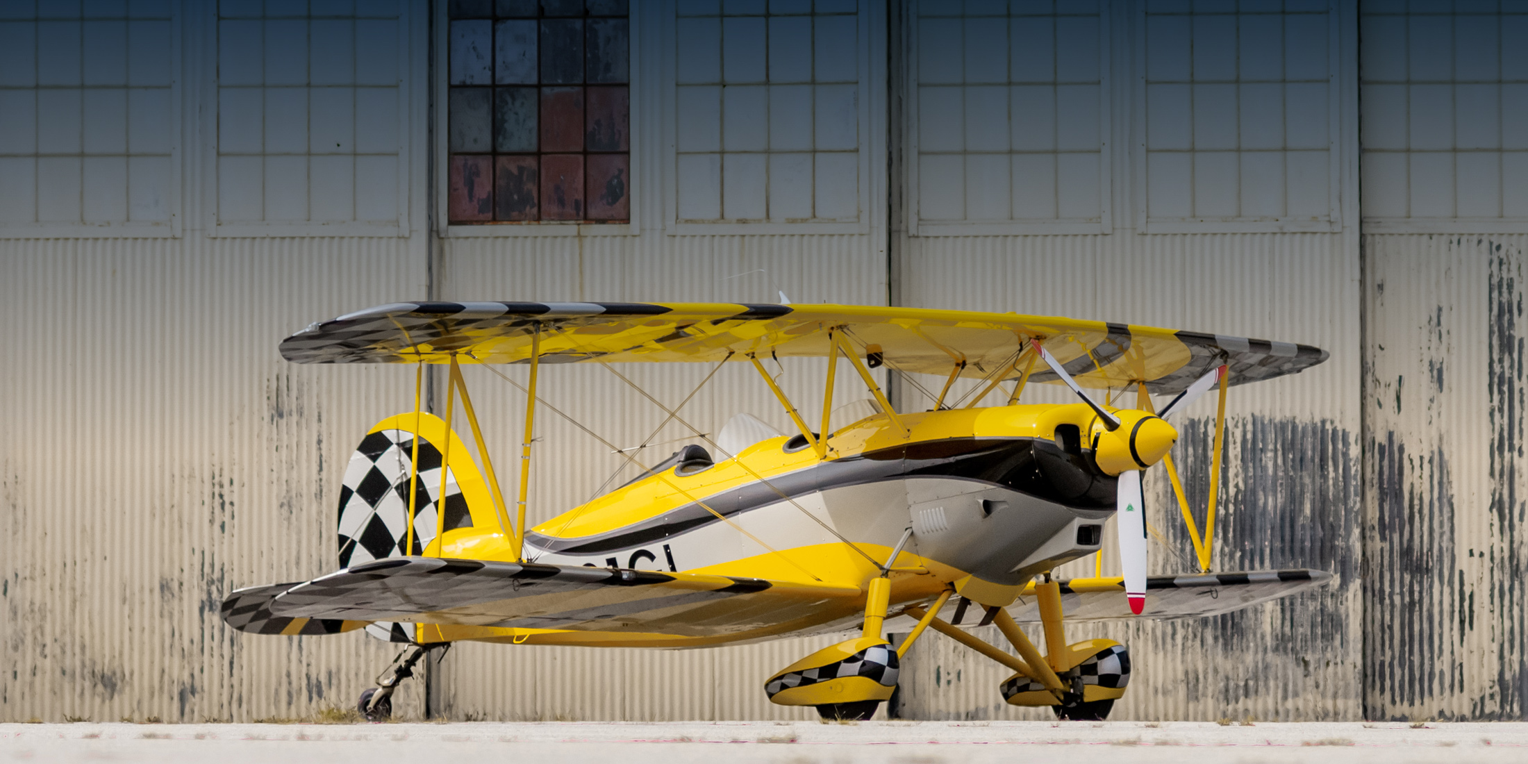 Great lakes plane in front of hangar