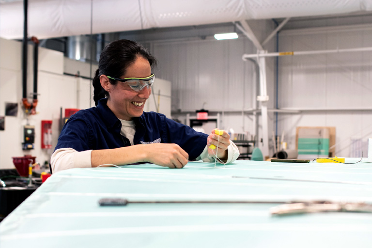 female mechanic working in shop